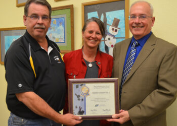 School Board honors couple for installation of crosswalk on Highway 119