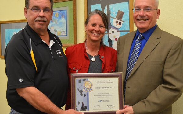 School Board honors couple for installation of crosswalk on Highway 119